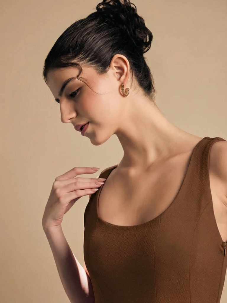 brown-stretchable-corset-fit-and-flare-midi-dress-fabric-zoom-in-uptownie.png