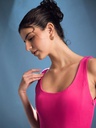 barbie-pink-stretchable-corset-fit-and-flare-midi-dress-fabric-zoom-in-uptownie.jpg