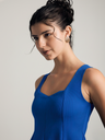 navy-blue-stretchable-ribbed-peplum-top-side-fabric-zoom-in-uptownie.png