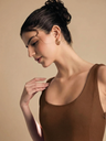 brown-stretchable-corset-fit-and-flare-midi-dress-fabric-zoom-in-uptownie.png